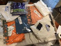 Overview of all items: three Lacoste polos, one Under Armour polo, two Nike white polos, white tennis shorts