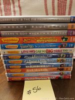 Stack of 12 VeggieTales and Larry-Boy DVD spines showing titles and colorful graphics on cases