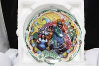 Front view of the Wizard of Oz collector plate inside protective white foam packaging.