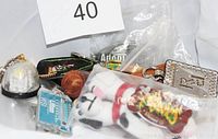 Photo showing assortment of vintage keychains with varying colors, materials, and sizes.