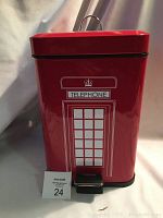 Front view of red metal garbage bin designed like a London telephone booth with white window graphics and TELEPHONE sign with crown on top. Black pedal at bottom front and metal handle on lid.