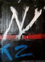 Full front view of abstract mixed media painting on canvas with white, red, blue spray paint over black textured acrylic and oil base.