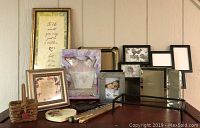 Full lot showing multiple picture frames, gift plaques, bride-to-be gift set, and other small decorative items
