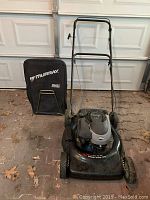 Full view of the Murray lawn mower with attached collection bag, showing overall condition and appearance.
