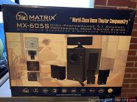 Full outer box of the Matrix MX-605S home theatre system showing model name and featured speaker and subwoofer components.