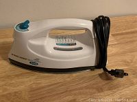 Side view of Black & Decker Quick'N Easy 300 iron with power cord wrapped around base.