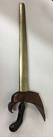 Full length photo of kris dagger in brass sheath showing overall length and condition.