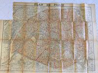 Full view of the antique two-piece map titled Plan de Paris, showing aged paper and wear