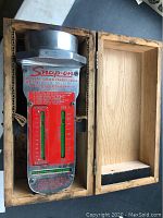 Snap-on Magnetic Caster-Camber Gauge WA-60E in wooden box, showing full gauge and box interior.