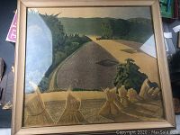 Full view of the watercolor print in a gold-toned frame showing the cornfield landscape with sheaves of harvested corn in the foreground and trees in the background