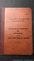 Front cover of the Canadian National Railways regulation book showing title and date reference.