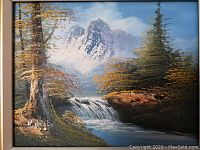 Close-up of the oil painting showing the mountain, waterfall, trees, and artist signature.