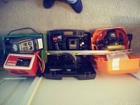Full lot overview showing 3 tool cases side by side, plus additional tools and accessories like the level and flashlight