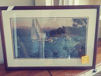 Framed print 'Windward' showing sailboats on lake with mountains; dark wood frame and white mat.