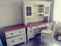 Full view of the desk with attached hutch and matching chair showing colonial style cream paint and wooden tops.