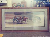 Full view of framed print leaning against carpeted floor with clocks and furniture in background