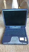 HP Pavilion laptop open showing keyboard, screen, and touchpad area