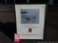Framed Curtiss NC-4 picture showing the historic seaplane, the fabric swatch, and accompanying text.