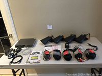 Overview of DVR, four cameras and accessories on table