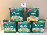 Photo shows all five sealed packages: four Mega size 58-count pads and one Jumbo size 48-count pads package.