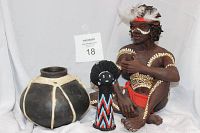 Photo showing three tribal items: sculpture of tribal man, beaded statuette, dark clay pot, with auction card 18 visible