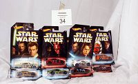 Photo showing 8 Hot Wheels Star Wars-themed cars in original packaging; characters and car names visible