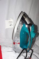 Side view of the Sunbeam steam iron showing the soleplate, water reservoir, and steam control.