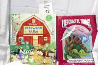 Photo showing 'Peekaboo Farm' book by Jane Dyer and 'Pterodactyl Tunnel' book covers.