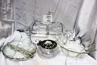 Photo showing the four items: round two-sided dip bowl, footed 3-slot serving tray with handles, flower petal fruit bowl, and Rancliff pewter pot.