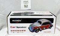 Box with image of Volkswagen car-shaped speaker and brand Hooked shown