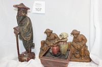 Photo showing all three items: Chinese Elder wooden statue, Syroco pirate bookends, and table fountain.