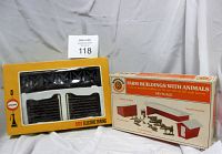 Photo showing Bachmann Farm Buildings with Animals kit box and Cox HO Electric Trains kit box with visible contents
