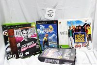 Photo showing front covers of the 8 assorted video games included in the lot with emphasis on Xbox, PlayStation 2, Genesis, and Nintendo Wii titles.