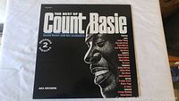 Album cover featuring 'The Best of Count Basie' with black and white portrait and artist list