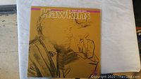 Album cover featuring sketched portrait of Coleman Hawkins in mustard yellow background with text 'Hawkins Body and Soul'.