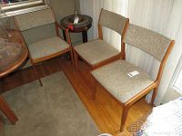Two chairs at room corner showing overall style and upholstery