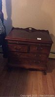 Front and side view of Century Furniture Company wooden end table showing drawers, pull-out writing desk, and carved legs.