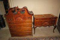 Two piece Century Furniture highboy dresser set seen together including upper chest with bonnet top and lower side cabinet with carved drawer fronts and cabriole legs. Shows wear including scratches and discoloration.