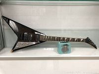 Side view of the GFX electric guitar with distinctive V-shaped body