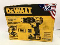 Front of DeWalt kit box showing model number, drill/driver illustration and kit contents icons
