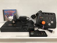 All items together: console, TurboPad, TurboStick, power adapter, game