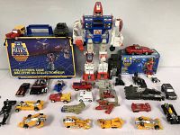 Overview photo of all GoBots toys and collector's case arranged on a flat surface.