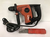 Hilti TE 7-C drill with power cord and red bit container