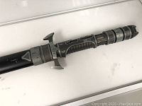 Full side view of sword handle and sheath