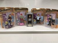 Full lot of 4 Osbourne family figures and 1 Duck Commander Willie Robertson Bobblehead in packaging.