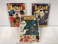 All three comic books bagged and boarded standing upright