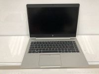 Open HP EliteBook 745 G5 laptop showing silver chassis, black keyboard, blank display