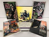 Overview of five Batman-related comic books with various covers featuring Joker, Batman, and other characters.