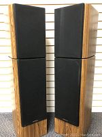 Pair of Venturi Model V830 speakers in a wood finish with black fabric grills.