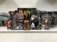 Wide shot showing full lot of loose and boxed movie and TV figures and toys including Star Trek, SeaQuest, and others.